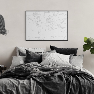 Blank world map poster above bed