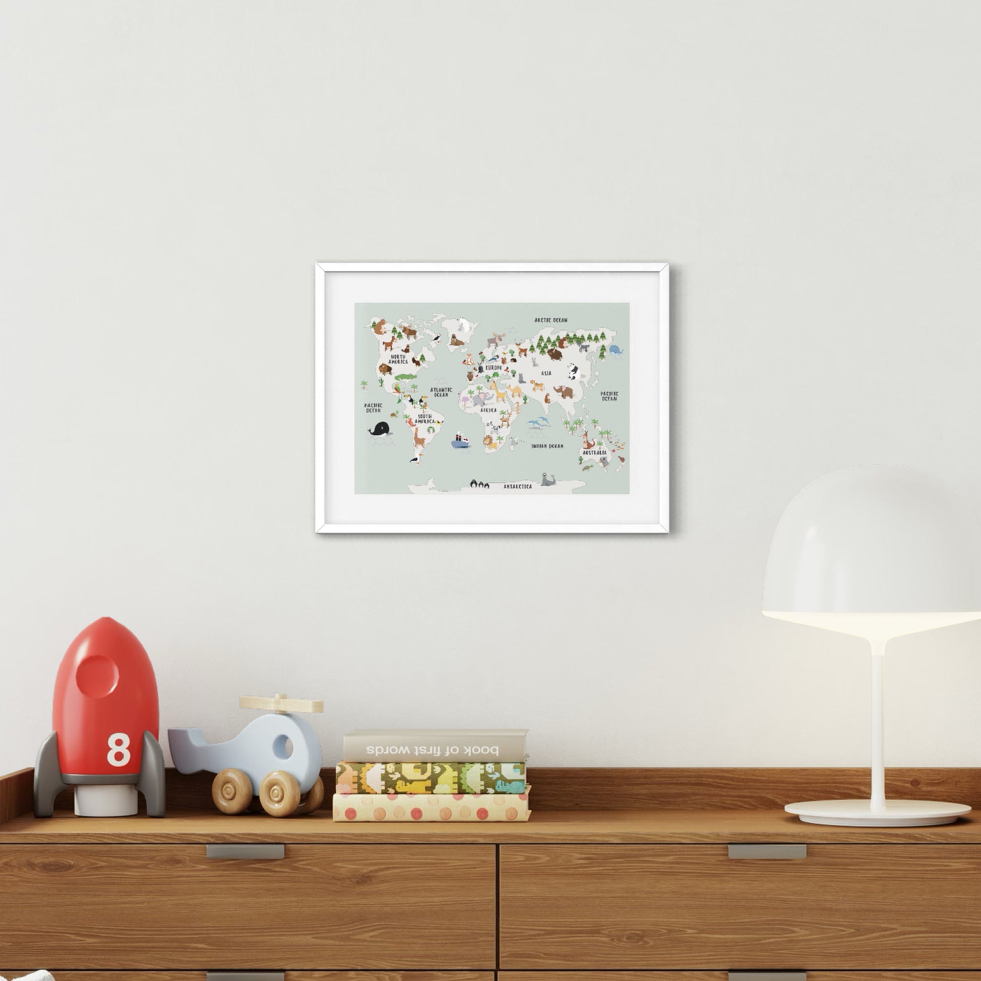 A3 Animal World Map Green Blue Framed Poster Print on Wall Above Chest of Drawers