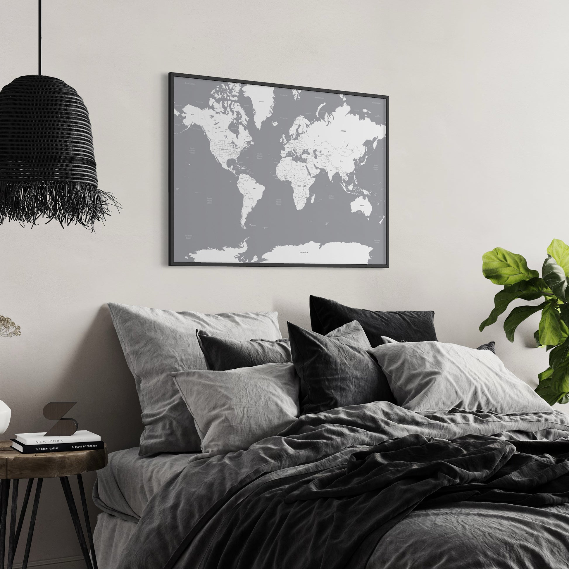 Grey and White World Map Poster Print on Wall Above Bed in Monotone Bedroom