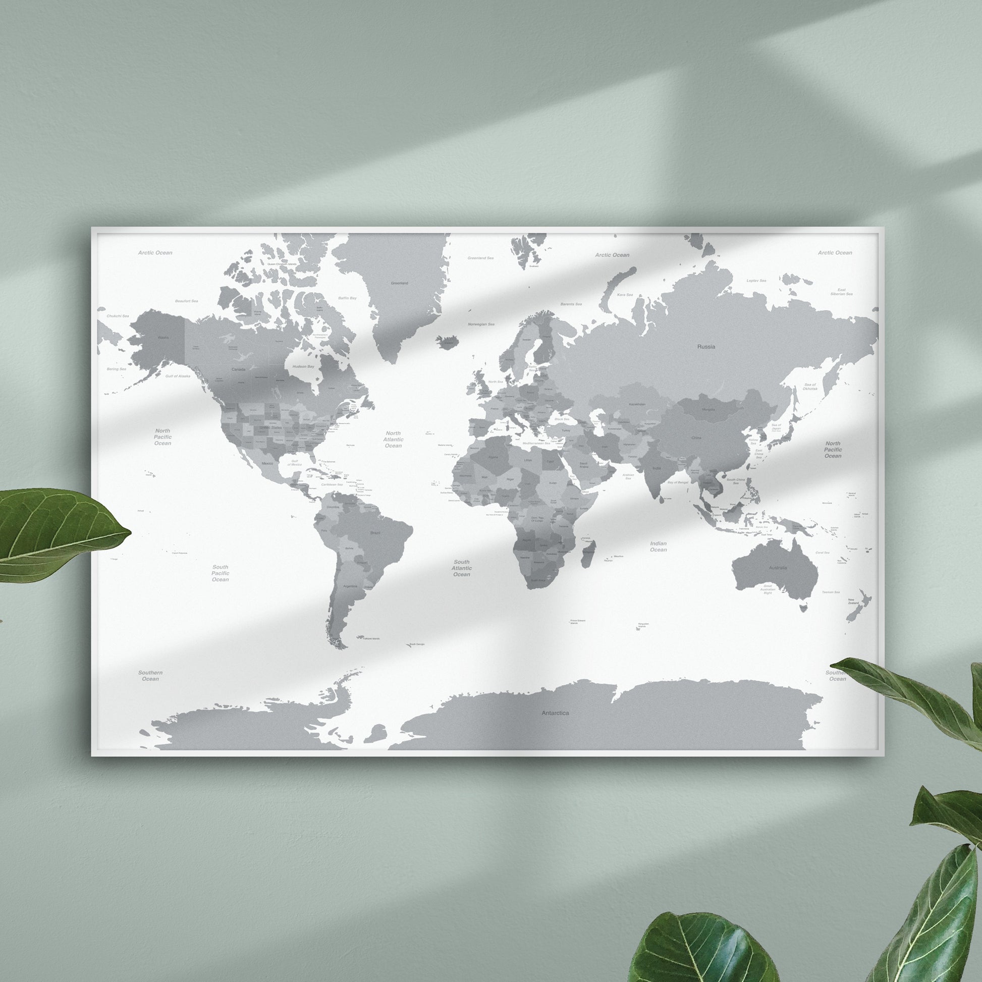 Grey Countries and White Sea Map of the World on Pale Green Wall with Shadows